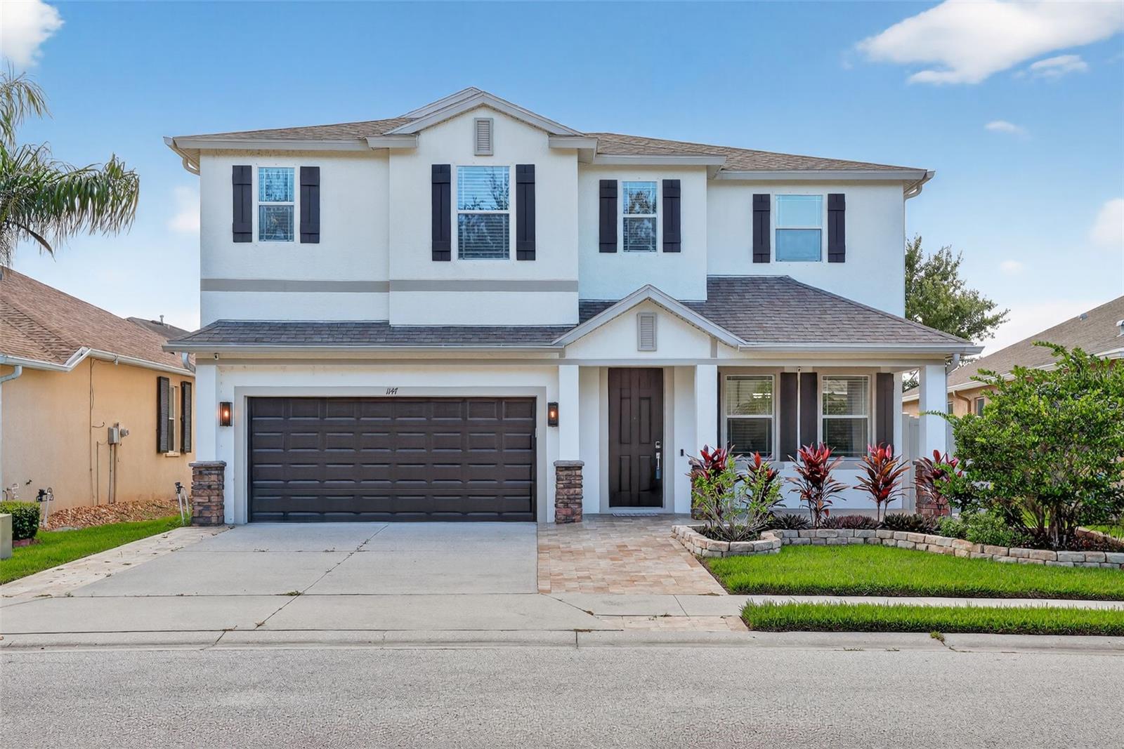 Welcome to this exquisite home in the gated Trinity East Community, where modern luxury & thoughtful design come together in perfect harmony. Priced at $599,000, this gorgeous 2,503 SQFT home offers 4 spacious bedrooms + downstairs office & 3.5 bathrooms, making it an ideal space for family living & entertaining. Built in 2013, this home boasts over $250K in premium renovations, such as LVP throughout the main living areas & porcelain tile in the bathrooms, laundry room & garage. Fresh, neutral paint on the walls, ceilings & trim further enhance the home’s bright inviting atmosphere.
Step into the heart of the home, where the fully remodeled, expanded kitchen offers a huge peninsula for ample counter space, new soft-close cabinetry & luxurious Dolomite countertops. High-end Samsung Smart Home Appliances, including wine fridge, make this kitchen a dream for everyday cooking & hosting gatherings. The bathrooms have all been completely remodeled from floor to ceiling. The home also features custom woodworking, such as wainscoting, built-in shelving, 7 1/4" baseboards, & full custom closet system in the primary bedroom, providing both beauty and function. You will find ceiling fans in every bedroom, the living room, & the back patio. The living room also conveys modern floating wall cabinetry, adding a touch of contemporary design.
For those who love the finer details, the home is packed with high-end finishes like stone and tile accent walls in multiple areas. The office has custom built-in cabinetry with crown molding, creating the perfect space for work or study. A new chandelier above the staircase, flush-mount LED lights throughout (including the garage), & color-changing LED lights in select rooms enhance the ambiance of the home. Brand new cordless blinds are installed throughout, with plantation shutters in the office. The garage is an organizer's dream, with two overhead storage racks & multiple Kobalt wall rail systems, perfect for keeping everything in its place.
The home also features smart home technology that makes everyday living more convenient. With a smart thermostat, rain-sensing sprinkler system, & smart garage door, you can control the home’s environment from anywhere. HVAC system was replaced in 2024. Wired for ADT security & water softener system conveys. The Samsung smart oven also comes with built-in thermometer & air fry mode, adding convenience to your kitchen.
Outside, the home continues to impress with custom landscaping that includes a stone garden bed and mature trees. Recent updates to the exterior include a Travertine driveway extension, along with new pavers in the back & side yard which lead out to a firepit area. Tan PVC fencing provides privacy while still offering stunning pond views. Upgraded exterior lighting create a welcoming environment for outdoor living. The home also features hurricane shutters for added protection during storm season.
This home also offers access to community amenities that include parks, walking trails, & easy access to local shopping, dining, & top-rated schools. Whether you’re enjoying the comforts of the home’s interior, relaxing in the beautifully landscaped yard, or taking advantage of the advanced smart home features, this property is designed to enhance your lifestyle. With its stunning design, modern upgrades, and exceptional attention to detail, this home is ready to welcome its next owner—contact us today for a private tour!
