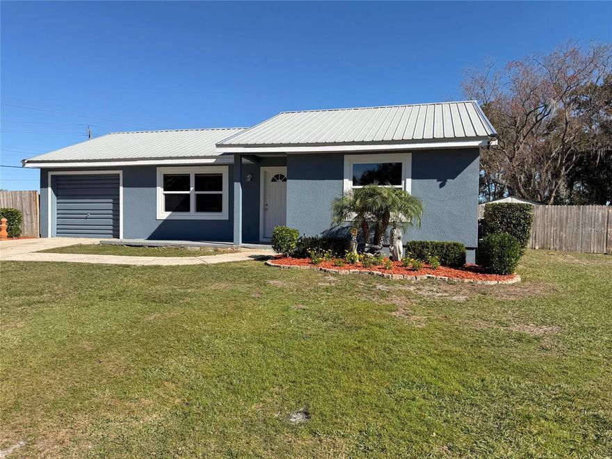 Experience the perfect blend of efficiency and outdoor freedom in this South Lakeland gem. Situated on a 0.51-acre lot, this 3-bedroom, 2-bathroom home offers 1,225 sq ft of living space and welcomes you with a meticulously maintained landscaping that offers instant curb appeal. The fully fenced backyard (2023) is a lush "food forest" featuring mature fruit trees: Mango, Papaya, Orange, Lemon, Raspberries, and Sugar Cane. This functional outdoor space also includes: two new sheds (2023/2024) for ample storage or workshop space, a Dog Kennel for your furry family members, and a stylish Stone Deck, perfect for weekend BBQs.Avoid the high costs of future maintenance! This home features brand-new Windows and French Doors (2025), along with new Stucco and a fresh, professionally painted interior and exterior (2025). The long-lasting Metal Roof (2000) offers superior protection and durability. Stay cool with the 2022 A/C system and enjoy the benefits of a Whole-House Water Filtration System (2023) and a 2023 Water Heater.Strategically located near the Polk Parkway and Harden Boulevard, you are "close to everything." Enjoy quick access to shopping, dining, and medical facilities, all while living in a peaceful setting with NO HOA. This is a wise, solid investment ready for its next owner!