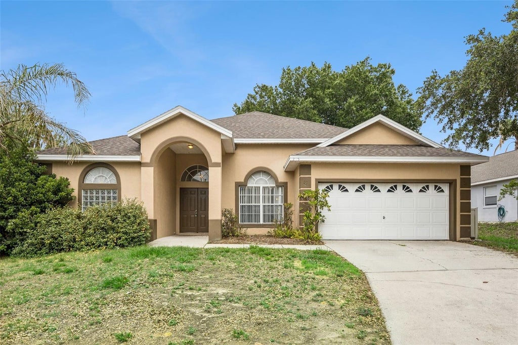 Photo of 215 Greeley Loop, Davenport, FL 33897 (MLS # O6412672)