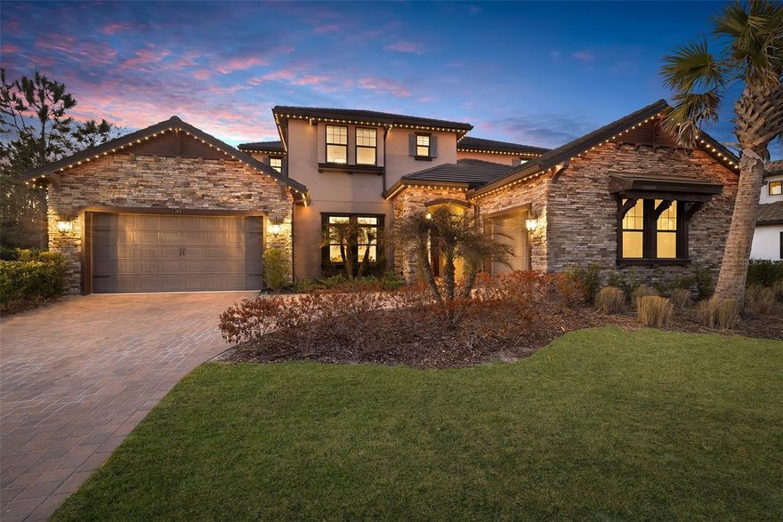 Step into resort-style living in the sought-after Estancia gated community with this beautifully designed 2020-built home offering the perfect blend of luxury, functionality, and lifestyle. The tile roof and included hurricane shutters provide peace of mind and durability, while thoughtful design choices, flexible spaces, and conservation views make this property ideal for both everyday living and entertaining. The curb appeal shines with an elegant stone front elevation and upgraded holiday LED trim lighting, giving you customizable, app-controlled exterior lighting year-round without ever climbing a ladder. Inside, the gourmet kitchen is a true showpiece featuring GE Profile appliances, double ovens, designer backsplash, under-cabinet lighting, and a sleek, open layout that flows seamlessly into the main living areas, perfect for hosting gatherings and busy day-to-day life. Throughout the home, you’ll appreciate crown molding, solid core interior doors, and pre-plumbing for a water filtration system, elevating both comfort and quality. Downstairs includes a versatile room currently used as an office with a full bathroom conveniently located in the hallway, creating an excellent option for guests or multi-generational living. Upstairs, the home really delivers on lifestyle. A spacious flex area is set up as an impressive pool table room, while the separate media room offers the perfect spot for movie nights or game day. The custom candy bar/concession stand adds a fun, unique touch your guests will love. Step out onto the screened-in upstairs balcony and enjoy peaceful views of the conservation area, an ideal place to unwind with your morning coffee or evening drink. Located in one of Wesley Chapel’s most sought-after communities, Estancia residents enjoy a resort-style clubhouse, pool, fitness center, walking trails, and beautifully maintained common areas, all within a gated setting close to shopping, dining, and top-rated schools. This home is a rare opportunity to enjoy an upgraded, move-in-ready property in a premier community with a true lifestyle feel.