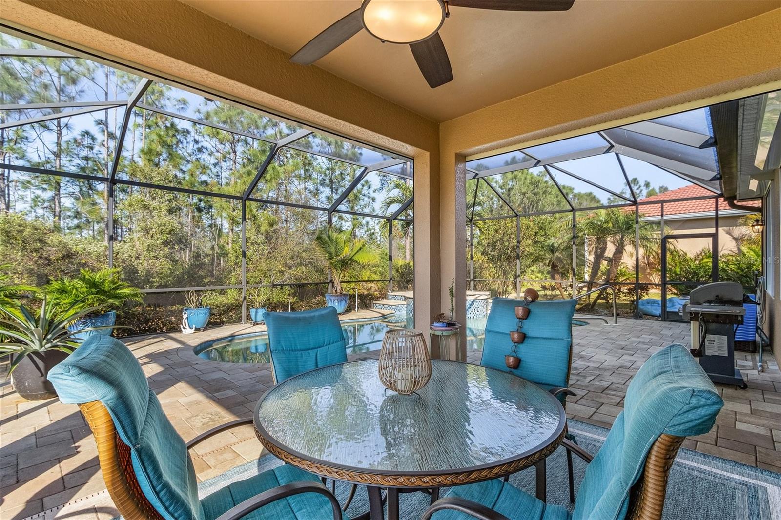 *BEST PRICE PER SQFT IN MAGNOLIA!!*Schedule A Same Day Tour On REDFIN App*Located on the most distinguished street in the desirable Magnolia Landing community, this upgraded 2-bedroom plus den, 2 bathroom Pembroke model home blends luxury, functionality, and privacy. Set back on the ~1/4 acre lot and backing to a protected preserve, the property ensures long-term seclusion. With advanced systems and premium finishes throughout, this home offers both comfort and style.
The open-concept design features a gourmet kitchen with granite countertops, tumbled marble backsplashes, soft-close cabinets with pull-out drawers, and upgraded appliances, including induction cooking technology. The spacious living and dining areas are ideal for entertaining, offering a seamless flow to the outdoor covered lanai. A custom TV installation area in the living room, with wires and cables concealed within the walls, conveys with the home for a clean, sleek look.
Impact-resistant doors and electric accordion storm shutters on the windows and lanai provide added security. The home is equipped with a GenerLink system for easy generator hookup and an integrated surge protector for peace of mind. MinkaAire ceiling fans with remote controls are installed throughout for optimal air circulation.
The primary suite offers a custom Kohler rain shower, a luxurious soaker tub with granite finishes, and a spacious walk-in closet. Another custom TV installation area ensures a sleek look in the suite as well. Upgraded lighting and fixtures, along with crown molding, 10-foot ceilings, and 8-foot doors, add an elegant touch to the entire home.
Outdoor living is exceptional, with a heated saltwater pool featuring a Pebble Tec surface, an infinity spill-over spa with glass tile, and LED lighting. The paver pool deck, set on concrete to prevent settling, ensures durability. The expansive lanai connects seamlessly to the indoor living areas, providing an ideal space for relaxation and entertaining.
Additional features include a temperature-controlled garage with epoxy flooring, built-in storage cabinets, and shelving. The upgraded laundry room includes a sink, as well as an upgraded HG washer and dryer. The den, an optional builder feature, has French doors and custom TV installation, allowing for flexible use as an office, media room, or additional living space.
The property is professionally landscaped to enhance privacy, with tropical plantings that create a secluded oasis. Located within a 24-hour gated community, Magnolia Landing offers resort-style amenities, including a Gordon Lewis-designed golf course (membership optional), a clubhouse with a restaurant and bar, fitness centers, and resort-style swimming pools.
This home, with its thoughtful design, high-end finishes, and prime location, provides a sophisticated living experience, combining privacy and convenience in an ideal setting. Welcome home!