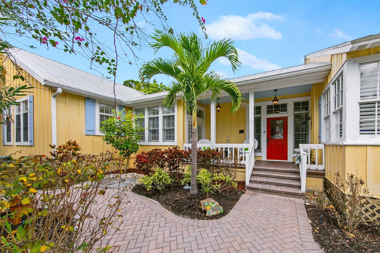 Welcome to The Morrison House, a stunning waterfront retreat that blends modern luxury with a touch of historic charm. Nestled along a deep-water canal just minutes from the Gulf of Mexico, this 4-bedroom, 3 ½ bath, 2,812 SF home offers a rare opportunity to embrace the ultimate Sarasota lifestyle. Originally built in 1996 and extensively updated through 2014, the primary residence is a showcase of current design, featuring soaring ceilings, expansive open spaces, and every modern convenience. Complementing this is the adjoined 1940s-era original cottage, a beautifully renovated gem that adds historic charm, making this property truly one of a kind. As you step inside, the grandeur of the modern home takes center stage. The open floor plan flows effortlessly from room to room, with abundant natural light streaming through oversized windows. The chef’s kitchen is a true showstopper, featuring premium two-toned cabinetry, sleek stone countertops, a custom range hood, and top-of-the-line appliances, including a wall-mounted oven and sleek cooktop. Adjacent to the kitchen, the spacious great room is perfect for gatherings, with large sliding doors opening onto the outdoor patio, seamlessly blending indoor and outdoor living. The luxurious primary suite is a private sanctuary designed for relaxation. Boasting an elegant, spa-inspired bath with chic finishes and a soaking tub, this space exudes tranquility. A private study adds versatility and makes this suite a perfect retreat.
The expansive outdoor living area features a sparkling pool and spa, surrounded by landscaping that ensures privacy and serenity. A private dock, complete with boat lift, provides deep-water access just a few lots away from the pass and Gulf of Mexico beyond. While the modern home shines, the property’s historic portion, known as The Morrison House, adds a unique layer of character. This charming 1940s cottage has been carefully preserved and integrated into the property, offering a cozy space perfect as a guesthouse or extension of your living area. With its heart pine floors, original cedar paneling, and vintage fireplace, it’s a delightful nod to Sarasota’s rich history. The local historic designation also brings significant advantages, including relaxed building codes, exemption from FEMA’s 50/50 rule, and tax incentives for further renovations—allowing you to personalize the property to your exact vision without compromising its integrity. In 2024, the home demonstrated remarkable resilience, weathering a hurricane and tropical storms with minimal impact. While some flooding occurred, immediate professional remediation was completed, and repairs are underway to restore the property to pristine condition. With quotes finalized, you have two exciting options: purchase now as-is at an incredible price and personalize the finishing touches, or wait for permitting and renovations to be completed and secure the home at a future higher price. With a seller-provided 2-year home warranty for peace of mind, this property is an incredible opportunity to own a resilient and beautifully updated coastal retreat. Use it as a spacious primary residence, scalable for your lifestyle, or make it your dream vacation retreat, located minutes from the powdery sands of Siesta Key Beach and vibrant Siesta Key Village. With a low 7-day minimum rental policy, it’s also perfect for the charming bed-and-breakfast you’ve always dreamed of owning. Schedule your private showing today.