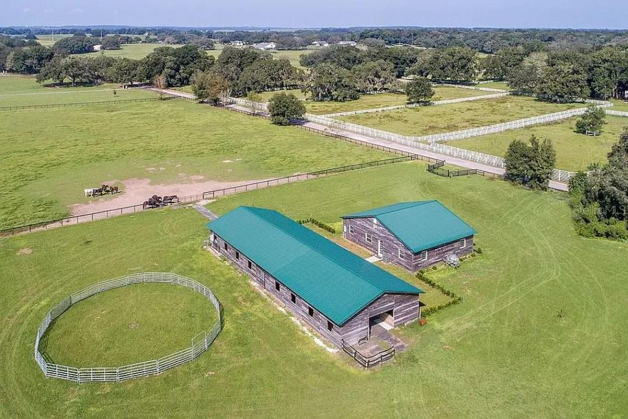 Gorgeous 18-acre property adjoining Trilby Trails Equestrian Community in Dade City, FL. Property includes a beautiful 2,000 sq ft, 4 bedroom , 2 bath dwelling with majestic high ceilings, huge closets, generous attic space, and uv protected/insulated windows . The property also includes a custom 15-stall center aisle barn consisting of minimally sized 12 x 12 fully matted stalls, galvanized steel Triton stall fronts and sliding doors, complete with feed openings and upper door openings, automatic waterers and individual remote powered fans in each stall. The barn also has a bathroom, washing machine, refrigerator, a concrete and matted center aisle, a separate 3-sided cross-tie grooming/ tacking area in the center of the barn, and outside wash stall. Property is fully fenced and cross-fenced with horse-safe no-climb fence wire,  flex rail and electric wire on top. The property's deep well and water conditioning system delivers high quality water with extremely good water pressure. Property is located within 5 miles to shopping, 7 miles to hospital, 7 miles to Pasco-Hernando State College East Campus, and 10 miles to St. Leo University. Also, 30 minutes to fast-growing Wesley Chapel community. For the competitive horse enthusiast, the property is within a 1 hour drive to Tampa Show Grounds, Florida Horse Park, Ocala’s World Equestrian Center, and HITS Show Grounds. Property consists of part of parcel #34-23-21-0000-01300-0000 and part of parcel #34-23-21-0000-01300-0070. Adjoining 10 acre parcel also for sale -