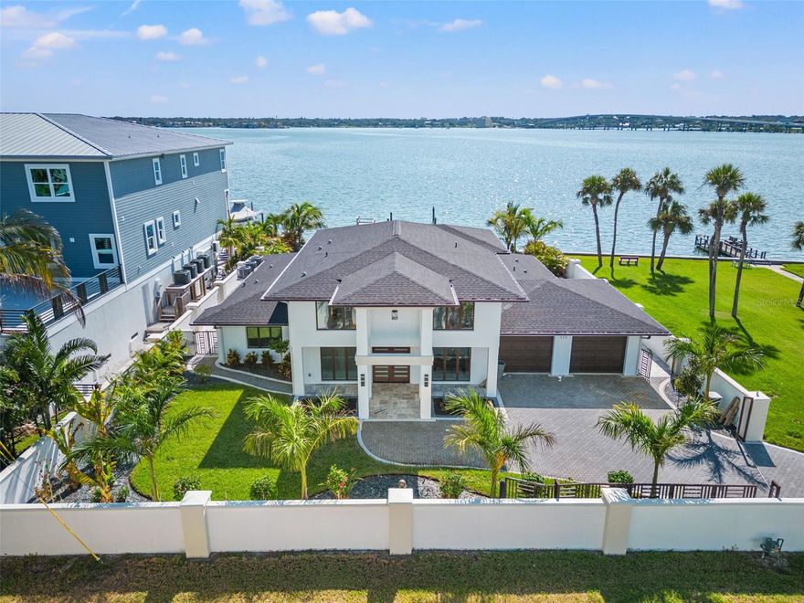 Welcome to your WATERFRONT oasis in beautiful Belleair Beach! This meticulously UPDATED home offers the perfect blend of luxury, relaxation and stunning water views! Located just a few short steps to the beach and right next to the Belleair Beach Park! As you enter through the grand double doors you'll be greeted by an open concept living space bathed with natural light. There is a seamless connection between the indoors and outdoors. This amazing new chef's kitchen is a culinary masterpiece boasting top of the line appliances, custom cabinetry, and a center island with bar seating. Its the ideal space for hosting family and friends while enjoying panoramic water views. Step outside to your private paradise, where a sparkling SALT WATER POOL WITH HEATER and expansive patio area await. Lounge by the pool, dine alfresco or sip cocktails on the dock, all while taking in the breathtaking views. The primary suite is a sanctuary of comfort and luxury, featuring a spa like ensuite bathroom. Just outside the primary suite is a loft area offering water views from the suite or comfy sitting space this area offers. The home's updates extend beyond aesthetics to include modern technology and energy efficient features, ensuring both convenience and sustainability. Boating enthusiasts will appreciate the deep water dock with easy access to the Gulf of Mexico, making it a breeze to embark on aquatic adventures or enjoy sunset cruises. Located in the sought after Belleair Beach community, this property offers not only a refined coastal lifestyle but also proximity to pristine gulf beaches, upscale dining and shopping options. Don't miss the opportunity to make this waterfront dream home yours. Schecule your private tour today and experience the best of Florida living in this COMPLETELY UPDATED Belleair Beach gem!