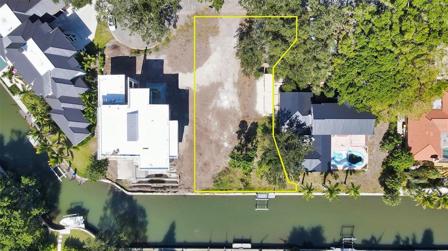 Waterfront Lot/Pre-construction. Option to purchase empty lot, as is, or purchase empty lot and build your dream custom home with Skyline Custom Development, an unmatched luxury waterfront home contractor/specialist. Located on a quiet piece of paradise in one of Sarasota’s most treasured neighborhoods, Cherokee Park, this lot offers endless possibilities. It is a one of a kind waterfront lot that presents 100 feet of water frontage and is tucked away at the end of a magical, banyan tree filled lane. This dream lot comes with a brand new boat dock located on a wide canal that leads you to the breathtaking Sarasota Bay. This ultimate location is just a short bike ride away from the world-famous Siesta Key Beaches, Southside Village, Morton's Market, Restaurants, Selby Gardens, Marina Jacks and trendy downtown Sarasota.