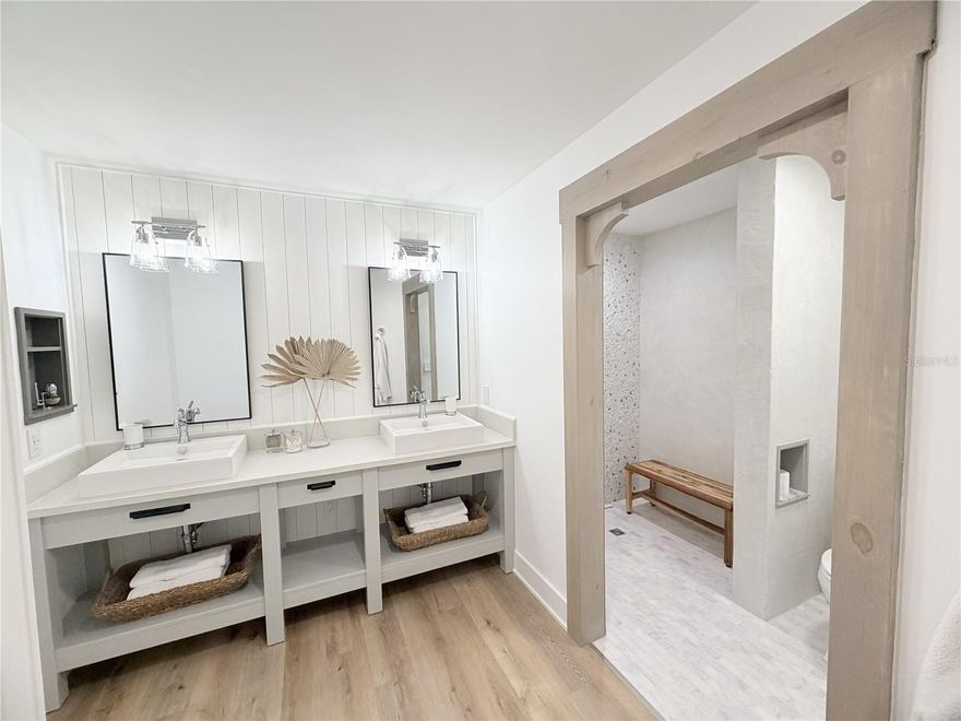 Beautifully renovated condo offering modern design and high-end upgrades throughout. This move-in ready home features luxury vinyl plank flooring with cork padding, a fully redesigned kitchen with custom solid wood cabinetry, soft-close drawers, and premium KitchenAid and Fisher & Paykel appliances.

Enjoy spa-inspired bathrooms with waterproof shower systems, elegant tile work, and upgraded fixtures. The home has been thoughtfully enhanced with widened doorways for accessibility, custom trim and finishes, upgraded lighting, and a sleek Level 4 smooth wall finish.

Major improvements include a new HVAC system, water heater, insulated garage door, and a 12-ft energy-efficient sliding glass door that fills the space with natural light. Additional features include custom closets, built-in storage, updated electrical, and smart wiring. Over $80K in renovations make this a rare, turnkey opportunity