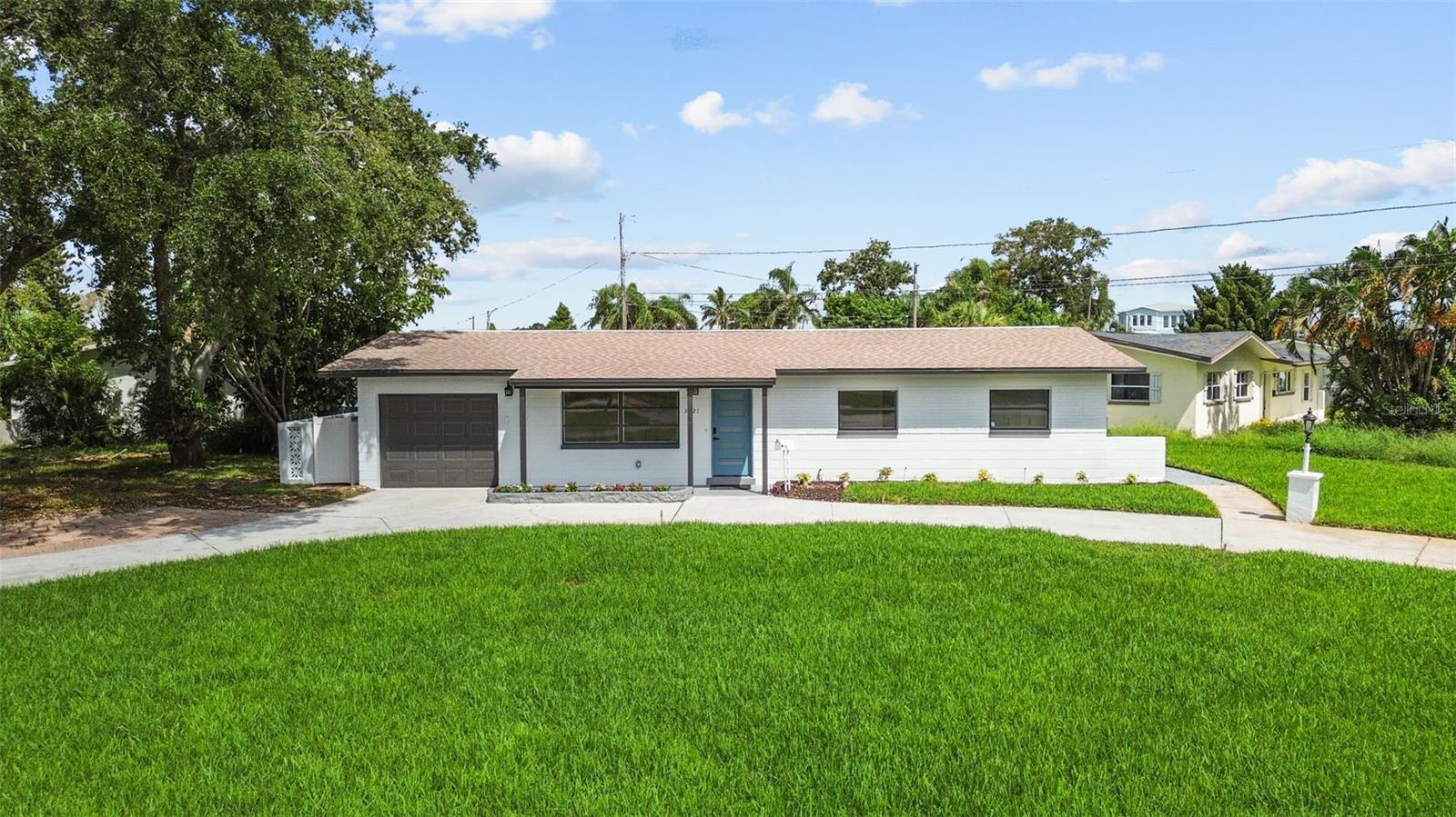 One or more photo(s) has been virtually staged. Welcome to this beautifully reimagined 4-bedroom, 2-bath single-family home in the highly desirable Coquina Key neighborhood. Situated on a corner lot, this residence combines modern updates with spacious living.
Step inside to find brand-new ceramic tile flooring throughout and a formal living room featuring recessed lighting and expansive windows that fill the space with natural light. The oversized family room boasts French doors that open to a covered patio, creating the perfect indoor-outdoor flow for entertaining or relaxing.
The kitchen is a chef’s delight, equipped with brand-new LG stainless steel appliances, an oversized pantry, breakfast bar, and cozy dinette area—an ideal multi-purpose eating space for family and guests.
The guest bathroom offers a spa-like retreat with a stunning birch wood accent wall, tub-shower combo, dual-sink vanity, and a luxurious rain showerhead. The primary suite features an ensuite bath with a dual vanity, glass-enclosed shower with built-in seating, and a rain showerhead for ultimate relaxation.
Additional highlights include remote-controlled ceiling fans in every room, a brand-new HVAC system, and thoughtfully designed spaces throughout.
Enjoy the convenience of being walking distance to Coquina Key Park, featuring pickleball courts, a soccer field, pet park, playground, tennis courts, athletic courts, and picnic areas. Located less than 5 miles to downtown St. Petersburg and under 10 miles to the beaches, this home offers the best of Florida living.