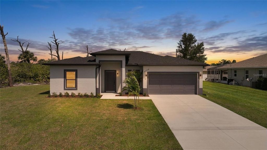 Photo of 11370 Gulfstream Boulevard, Port Charlotte, FL 33981 (MLS # C7524137)