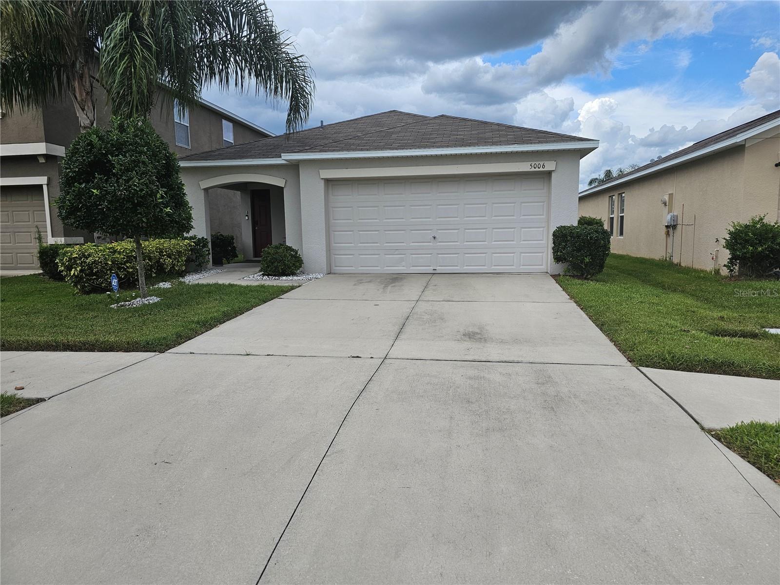 Enjoy coming home to this beautiful 3-bedroom, 2-bath home. The kitchen offers a large island, great for gathering. The spacious, open floor has a neutral gray tone tile throughout, except for the bedrooms, which have carpet. All appliances are included, as well as the washer and dryer, which are located in a separate laundry room. What sets this home apart from all the rest in the community is the Location. It is situated across the street from the Resort Style Amenities! You can walk out the front door and head straight to the pool or fitness facility. The community offers a clubhouse, pool, and splash area, tennis courts, Pickleball courts, a fitness center, walking trails, and more. This home is also USDA eligible!! Welcome Home!!!