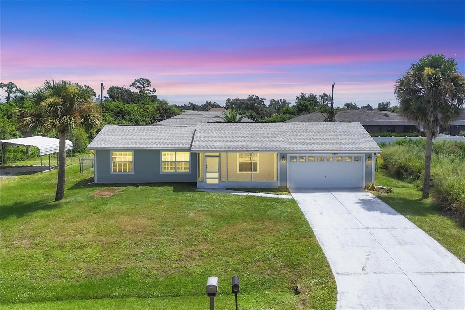 DON'T MISS OUT! Opportunity awaits the lucky new homeowner of this immaculate jewel on a large DOUBLE LOT of nearly half an acre! This freshly painted 2 BD / 2 BA features new flooring, a cathedral ceiling and plantation shutters in the living area, a generous size walk-in closet in the Master Suite, a dining room with sliding glass doors that open up to the fully enclosed Florida Room, dinette/eat-in area in the kitchen with a beautiful bay window overlooking the expansive fenced-in backyard, a large interior laundry room, large screened-in front porch, 2 car garage, plus a 2 car carport for additional vehicle storage separate from the garage and driveway. Bring your boat! Bring your RV! No deed restrictions and close proximity to shopping, dining, with easy access to beaches and commuting routes, makes this property an ideal location. The possibilities for this property are endless. This home is priced to sell. Don't let this amazing opportunity pass you by! Call to schedule your exclusive showing today!