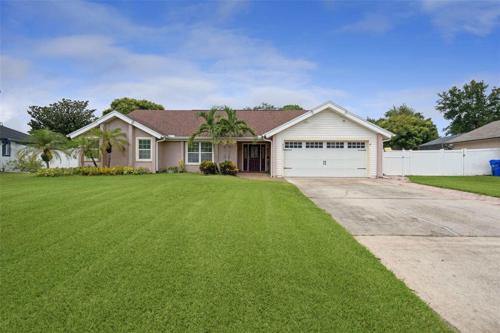 Discover this well-cared-for Lake Mary pool home, offering a spacious one-story layout perfect for Florida living. Featuring 4 bedrooms, 3 full bathrooms, and set on nearly half an acre (0.48 acres), this property offers space, privacy, and tons of natural light. The home sits on a fully fenced lot with classic white vinyl fencing, a long driveway perfect for hosting family and friends over, and a beautiful screened-in, solar-heated pool with a large lanai for year-round outdoor living. Vaulted ceilings, skylights, multiple sliders out to the pool and a comfortable split floor plan are just a few of the special highlights. The large owner's suite features sliders out to the lanai and a spacious bath with a soaking tub, stand-up shower and two vanity areas for maximum elbow room! Located just minutes from shopping, dining, and everyday conveniences, with easy access to I-4 and the 417 to zip around Central Florida, the airports and top-rated Seminole County Schools, this home blends comfort, convenience, and lifestyle. Call today for your private showing. ROOF 2019.