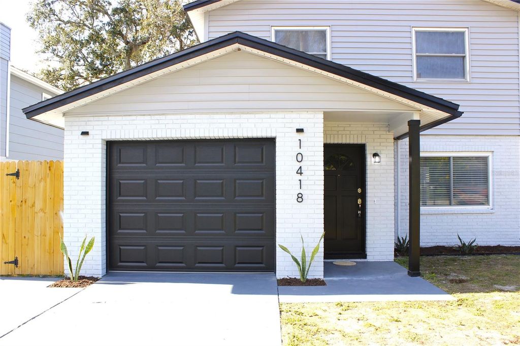 Photo of 10418 N Oklawaha Avenue, Tampa, FL 33617 (MLS # TB8458818)