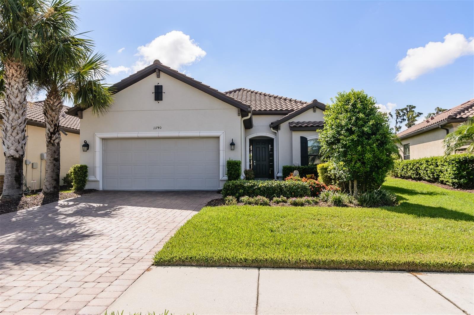 Welcome to Esplanade at Starkey Ranch, a prestigious gated community. This beautiful Taylor Morrison, Lazio model home located on a prime lot has 3 bedrooms, plus office/den or 4th bedroom, 3 bathrooms, and a 2.5-car garage and no rear neighbors. The quarterly HOA fee includes maintenance of the lawn, bushes, and irrigation system. Lovely brick paved sidewalk and driveway with lush landscaping which lead you into this amazing home. The back yard is private, huge and is lovely landscaped. The foyer is large, bright, and airy. The open concept kitchen, living/dining room design maximizes space and makes it easy to entertain. The kitchen boasts: quartz counters, 42” cabinets, island with a breakfast bar and cabinets, gas stove, stainless steel appliances, a closet pantry, and a sliding door to the Lanai. The (22’X24’) Lanai is screened, with roll down blinds for added privacy and lovely brick paver floor and a gorgeous featured wall. The primary bedroom is large with a door to the outside Lani, it features: a massive walk-in closet with custom cabinetry, a huge ensuite bathroom with a walk-in shower, granite counters and dual sinks. There are 2 additional bedrooms with lots of closet space and one of the bedrooms has its own private ensuite with walk in shower, granite counter top sink. An additional Hall bathroom with granite counter and a tub and shower. A bonus room is the office/den/or 4th bedroom. There are volume ceilings and crown molding throughout this incredible home. Separate laundry room with door to the garage. The garage floor is finished with epoxy and there is an abundance of shelving. Esplanade offers a beautiful private Club House, a resort style pool, a resistance pool or rejuvenating spa, fitness center, billiard/card room, a kitchen, tennis/pickleball courts, playground, firepit, and a dog park. There is a lifestyle director to organize activities which you can engage in with the community. Also, the surrounding Starkey Ranch Community has many miles of trails, pools, parks, playgrounds, and a library. It is close to great schools, churches, restaurants, shopping, the Suncoast highway, Golf courses, and a short drive to Florida’s award-winning beaches. This home is a must see!!!