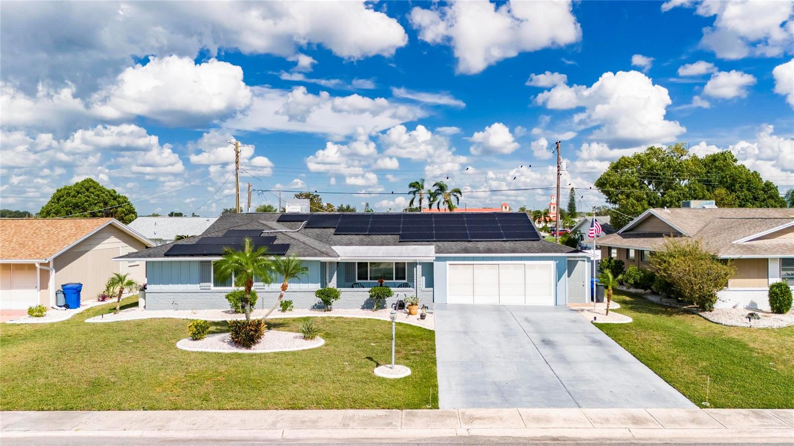 Welcome to 1743 Council Drive—your dream home in the heart of Sun City Center. This beautifully updated 2-bedroom, 2-bathroom residence offers 1,847 square feet of thoughtfully designed living space, perfectly suited for comfort, style, and the active Florida lifestyle. The open floor plan creates a bright, airy flow throughout the home, ideal for both relaxing and entertaining. Inside, you’ll find luxury vinyl plank and tile flooring throughout, paired with hurricane-rated windows for added security and peace of mind. The home is loaded with modern upgrades, including a 2024 air conditioner, tankless water heater, and a Culligan reverse osmosis system with water softener, providing pure, clean water throughout. Energy efficiency is a standout feature with fully paid-off solar panels, dramatically reducing your electric bills. Additionally, the sewer line has been relined with APT epoxy coating—a $31,000 investment that adds long-term value and durability. Freshly painted inside and out, the home shines with tasteful touches such as updated blinds, crown molding, remote-controlled ceiling fans, and modern fixtures. The kitchen is a true highlight, featuring stainless steel appliances, quartz countertops, an island with bar seating, and ample cabinetry—blending functionality with elegance. Both bathrooms have been stylishly remodeled for a clean, contemporary feel. Enjoy Florida’s beautiful weather from the comfort of your screened lanai, perfect for morning coffee, evening relaxation, or entertaining guests outdoors while staying protected from the elements. You’ll also appreciate the spacious interior laundry room with a newer washer and dryer, along with the custom-built storage addition off the garage, complete with a separate entry door. Located in one of Florida’s most vibrant 55+ communities, you’ll have access to over 200 clubs and activities, multiple clubhouses, swimming pools, and endless opportunities for connection and recreation. Don’t miss this opportunity to own a truly move-in-ready home in a dynamic and welcoming neighborhood. Schedule your private tour today and experience the charm, comfort, and convenience of life at 1743 Council Drive.