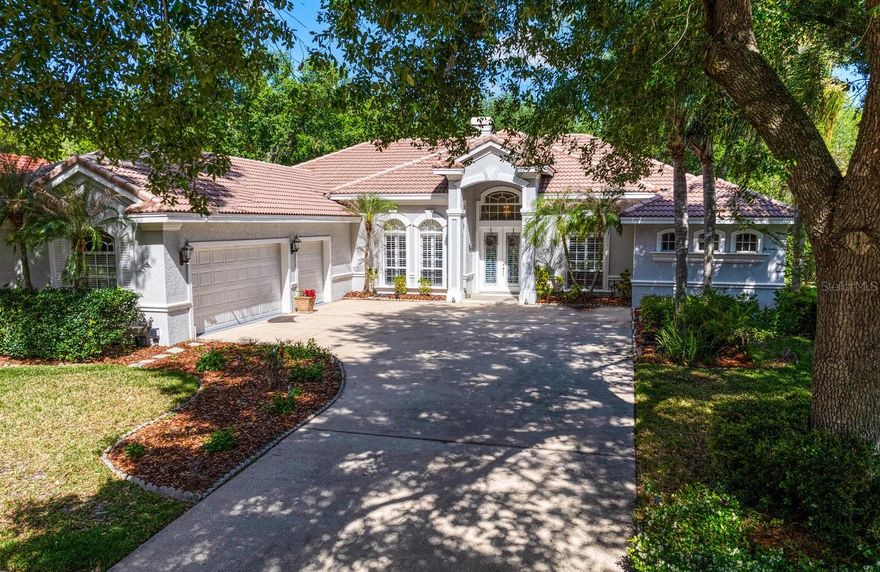 Welcome to this one of a kind Hannah Bartoletta custom built pool home, located in the gated Enclave Village of Arbor Greene in highly desirable New Tampa. This beautifully maintained pool home in Tampa offers 4 bedrooms + office (optional 5th bedroom), 4 full bathrooms, a 3-car garage, and 3250 square feet of living space, perfectly positioned on a premium conservation lot with privacy. This move-in ready Tampa pool home has been thoughtfully updated with brand new tile flooring throughout the main living areas and a modernized kitchen featuring granite countertops, 42” cabinetry, and abundant storage—ideal for buyers searching for an updated kitchen in New Tampa. The open-concept layout, crown molding, fireplace, and natural light create a warm yet functional space for everyday living and entertaining.
A major advantage of this home is natural gas service, allowing for gas cooking, gas heating, gas pool heater, and a gas fireplace—a highly desirable feature rarely found in many Tampa communities. In addition, the neighborhood is equipped with Verizon fiber-optic infrastructure, offering the potential for ultra-high-speed internet up to 7 Gig, making this home future-ready for remote work, streaming, and smart home integration. The oversized primary suite features a sitting area, and a private en-suite bath, while the flexible office easily serves as a 5th bedroom, guest suite, or home office, meeting the needs of today’s buyers. Secondary bedrooms are spacious and well-positioned for privacy. Step outside to your screened lanai with private pool and spa overlooking peaceful conservation—delivering the privacy buyers want in a conservation lot home in Tampa. Even more unique, this homesite allows for a 48” black wrought iron-style fenced yard, creating a rare opportunity for a pet-friendly home in a gated Tampa community without compromising your view.
Beyond the home itself, Arbor Greene stands apart as one of New Tampa’s premier master-planned communities. Developed as a Community Development District (CDD), it operates with a level of structure and long-term planning similar to a small municipality—ensuring consistent maintenance, infrastructure oversight, and preservation of property values. Spanning nearly 600 acres, Arbor Greene is known for its mature landscaping, scenic lakes, wetlands, and tree-lined streets that create a peaceful, nature-connected environment. Residents enjoy 24-hour manned gate security and resort-style amenities including multiple pools (featuring a junior Olympic lap pool), a fitness center, Har-Tru tennis courts, and pickleball courts, playgrounds, lakeside gathering areas, and over 26 miles of walking and nature trails. At the center of the community is a vibrant clubhouse and community center that hosts events, social gatherings, and activities that foster a strong neighborhood feel. Whether you’re looking for an active lifestyle or a quiet retreat, Arbor Greene offers a balance of privacy, security, and connection that’s difficult to replicate. Conveniently located in the 33647 corridor, this home is just minutes from top-rated schools, major hospitals, shopping, dining, golf courses, and with easy access to I-75 and I-275, making it ideal for both daily living and long-term investment.