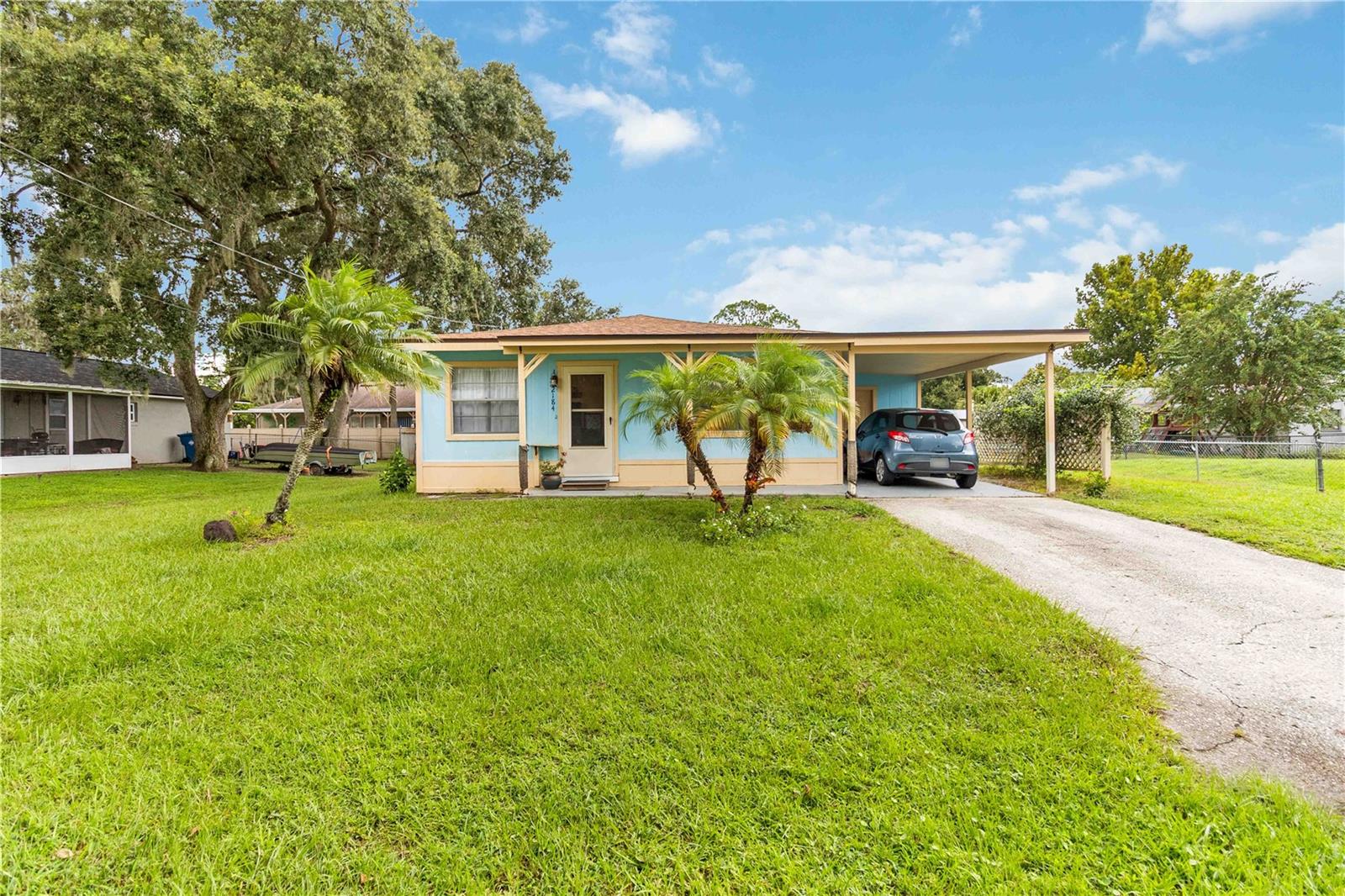 Charming 3 Bedroom Home – No HOA or CDD! This beautifully maintained 3BR/1.5BA home offers 965 sq. ft. of comfortable living space with country charm and classic appeal. Recent improvements include: roof (2022), AC (2021), flooring (2023), well pump (2023), water softener (2024), updated bathroom, and a brand-new stove (2025) so no need to spend extra money on those items anytime soon. The welcoming kitchen includes everything you need to make the most out of every dinner experience and flows into the homes cozy living areas. Enjoy a partially fenced backyard with a covered, screened patio for entertaining or enjoying the summer evenings with friends. The utility shed provides extra storage or make it your own she shed or man cave. Conveniently located near major highways, shopping and dining making commutes and daily errands a breeze. Close to the Sunny Florida beaches and affordable price makes this home perfect for first-time buyers, downsizers, or investors!