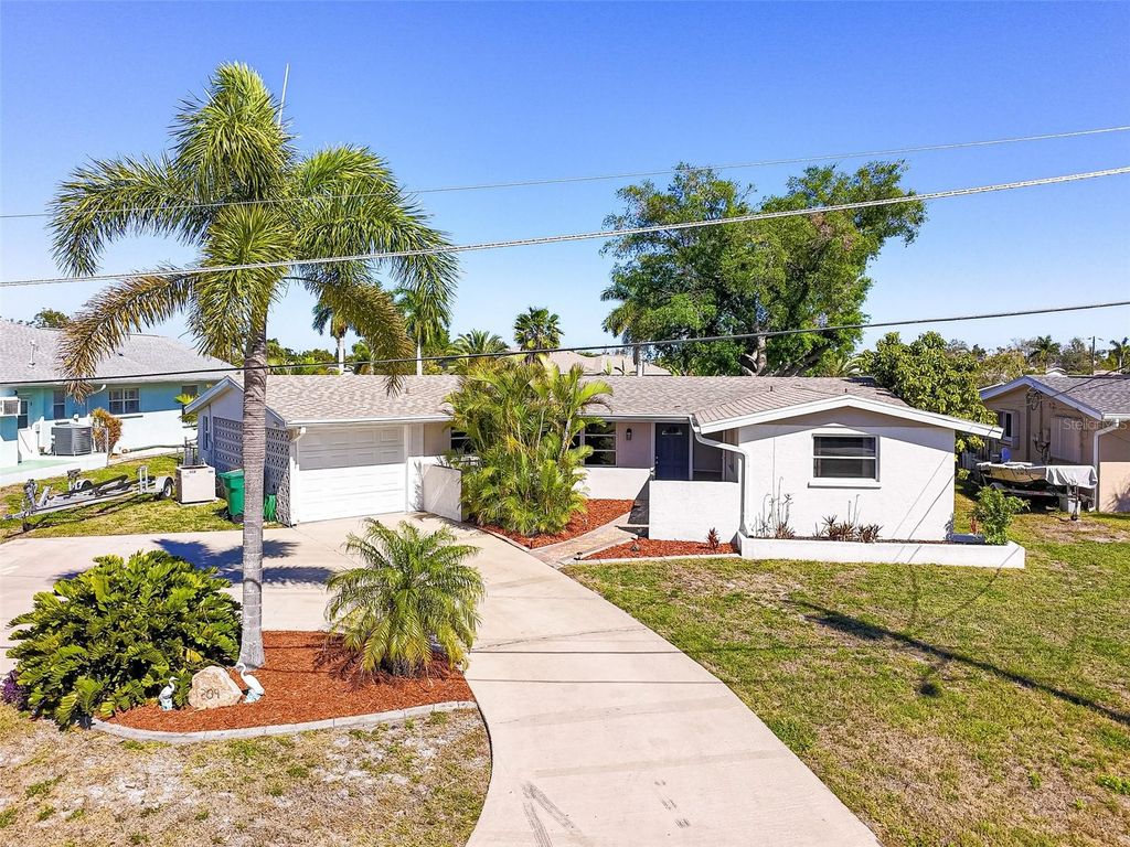 Photo of 209 Deerfield Avenue NE, Port Charlotte, FL 33952 (MLS # C7523909)