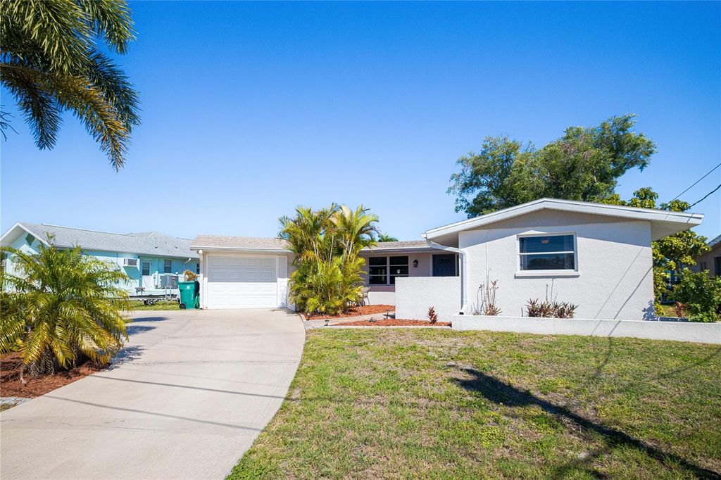 Photo of 209 Deerfield Avenue NE, Port Charlotte, FL 33952 (MLS # C7523909)