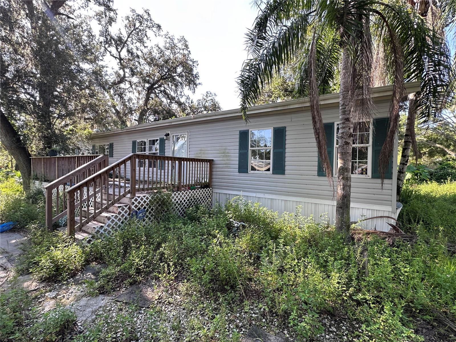 Short Sale. Unapproved Short Sale. 5/2 mobile home on over a quarter acre with a spacious and open, split floor plan. Master suite with en suite bath and walk in closet. Spacious kitchen and living area with 4 additional bedrooms. Recent updates in 2022 include: roof, attic insulation, electric water heater, kitchen cabinets, countertops, flooring, A/C heat pump, drywall, interior doors.