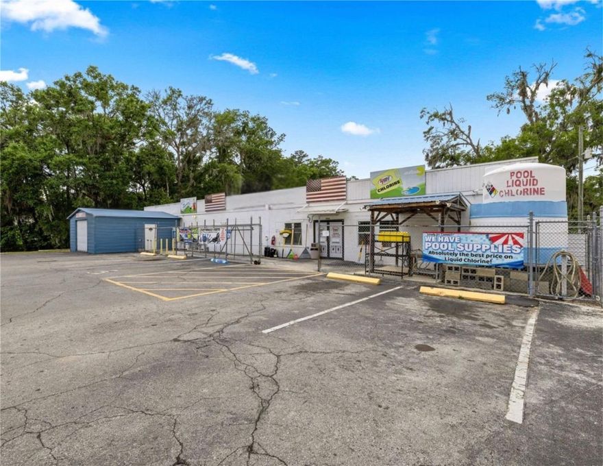 Prime opportunity to own a versatile commercial property with strong existing infrastructure and income possibilities. This 4,216 sq ft concrete block building is currently operating as a hardware store and sits on a .61-acre parcel, offering excellent visibility and accessibility.
Included in the sale is an adjoining .56-acre parcel, currently utilized as overflow parking and an outdoor event space—providing added flexibility for expansion, additional business ventures, or increased customer capacity.
The property features a new roof installed in 2021, two metal storage buildings, and valuable operational components including propane and chlorine tank dispensary systems that will convey with the sale.
Zoned B2 and B4, this property allows for a wide range of commercial uses, making it ideal for retail, and service-based businesses.