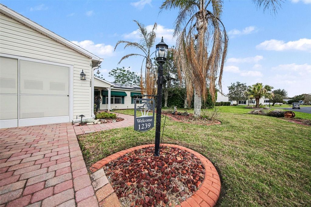 Photo of 1239 Chaparral Drive, Lady Lake, FL 32159 (MLS # O6394215)