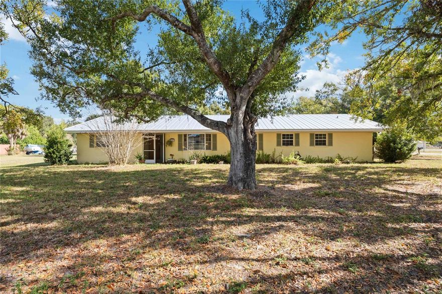 Opportunity is most definitely knocking... This spacious POOL home sits on almost a one-acre lot, offering the ideal space for pets, toys, and hobbies, with plenty of room to spread out. The extended driveway and oversized 2 car garage ensure convenient parking and storage for all your needs. The floorplan offers 3 bedrooms, 2 1/2 bathrooms, a formal living room that can be transformed into a den or home office plus an additional bonus room. There is a fenced dog run area, frontload LG washer and Dryer, walk-in closet in the primary bedroom and potential in this home.  Imagine you're hosting poolside gatherings, enjoying family time, or simply relaxing in peace, this home is ready for you to make it your own. It's a rare find in a prime "in town"  location perfect for both everyday living and entertaining. A brand new metal roof was installed in 2024. AC was installed in 2018 according to the county permit records. A true must see!!