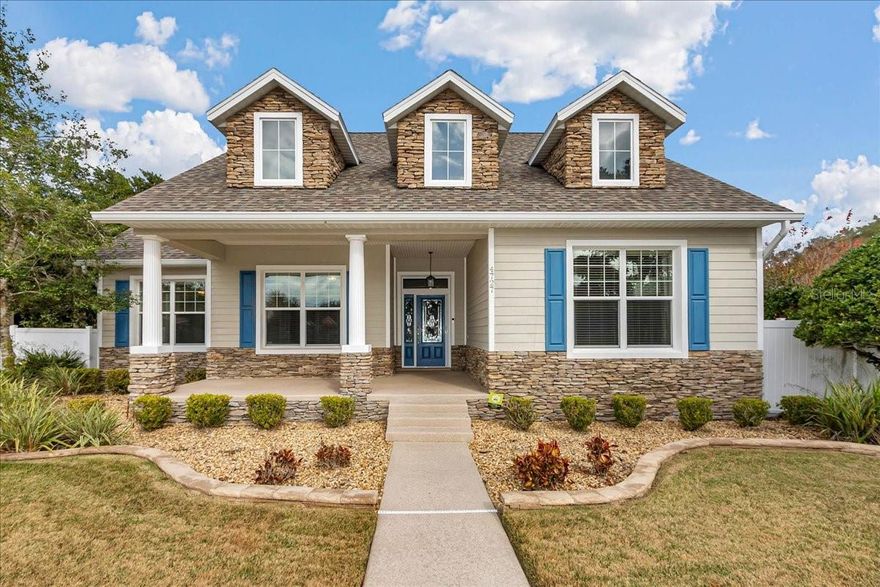 Amazing opportunity to own a beautiful Fabian built home in prestigious, gated Magnolia Park.  This 4 Bedroom 3 bathroom home sits on a desirable corner lot overlooking park space and offers exceptional curb appeal with stone accents, dormers, a charming front porch, and rear-entry garage via alley. Inside, the open and spacious floor plan features soaring 10–11 ft tray ceilings, a Living Room, Breakfast Room and a formal Dining Room/Flex Space. The Kitchen boasts custom wood cabinetry, decorative shelving, range hood with gas range, wine rack, solid-surface countertops, pantry closet, an island with a prep sink and a breakfast bar, a coffee bar and an eat-in area.  There are plenty of outlets for your appliances. There is no carpet throughout—only wood and tile flooring—including oversized bedrooms and a split-bedroom layout.  The Master Suite is generously sized with it's own ensuite bathroom featuring dual sinks, walk in shower, jetted tub, separate water closet and a large walk-in closet.  The Living Room has a cathedral ceiling, stone gas fireplace, built-in cabinets, a storage closet, and french doors that lead to a private, screened lanai, a well thought out patio area and a resort style relaxation pool.  There is also a full bathroom that is accessible as a pool bath.  A hallway leads to the Guest Wing featuring 3 bedrooms, a bathroom with dual sinks and separate tub/shower/commode room.  A well appointed Laundry Room with ample cabinet space and a laundry tub can be found on this side of the house as well.  This home includes numerous interior upgrades such as trim molding throughout, tray ceilings, built in lighting, tons of closet space and a dry bar/butler's pantry with space for a wine fridge.  There is also tons of natural light!  Outside you will find an oversized driveway with enough room to fit three cars sided by side and a full sized truck or SUV lengthwise.  There are two separate fenced-in areas outside, one being by the pool that is fully fenced for privacy and is cross fenced for a dog run or play area.  The other side extends alongside the length of the west side of the house and has a concrete pad and storage bin for all the toys.  There is an outdoor shower, separate concrete pad with screening for the trash cans, mature landscaping, gutters, a hot tub, and a covered grilling area.  The AC was replaced, the roof was replaced in February 2024, the water heater was replaced, and the sprinklers has been recently serviced.  As a resident of The Park, you'll enjoy access to exclusive gated amenities, including a private playground, pickleball court, and a covered pavilion perfect for celebrations and neighborhood gatherings. Located just minutes from schools, shopping, medical centers, recreation and Ocala’s vibrant downtown, this home offers the perfect blend of comfort, craftsmanship, and community and is ready to be moved into.  When you see it you will love it!!