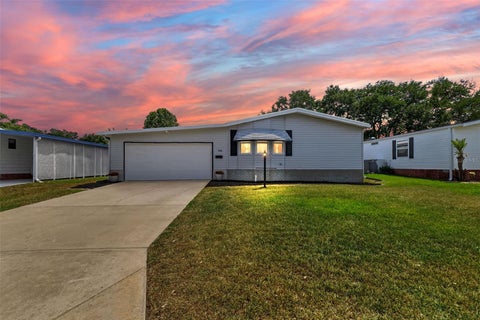 Photo of 706 Tangerine Drive, Lady Lake, FL 32159 (MLS # G5111790)