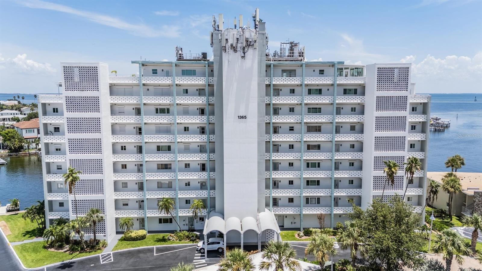 Incredible Value Priced Below Market! Don’t miss this rare opportunity to own a beautifully updated 2-bedroom, 2-bathroom waterfront condo in the prestigious Brightwaters Tower Condominium on Snell Isle—just minutes from vibrant Downtown St. Petersburg. Thoughtfully priced below market value, this move-in-ready unit offers an unbeatable combination of elegance, comfort, and investment potential. Enjoy stunning views of Tampa Bay's Smacks Bayou from your private second-floor balcony surrounded by lush tropical landscaping, custom curbing, and landscape lighting. Inside, the open-concept layout features a chef-inspired kitchen with solid wood cabinets, quartz countertops, stainless steel appliances, under-cabinet lighting, and a spacious pantry. The split-bedroom floor plan provides privacy, while the primary suite includes a walk-in closet, water views, and premium window treatments. This well-maintained, secure building includes elevator access, hurricane shutters, and luxury amenities like a heated waterfront pool, clubhouse, grilling stations, fishing dock, overnight boating dock, private outdoor shower, and covered parking. Monthly maintenance covers cable, internet, water, garbage, pest control, irrigation, landscaping, roof, and exterior upkeep, making for a truly low-maintenance lifestyle. Perfect for full-time living or a seasonal retreat, this coastal gem offers quick access to Downtown, the Vinoy, parks, restaurants, beaches, and more. Act fast, opportunities like this don’t last long.Experience luxurious waterfront living without the premium price tag!