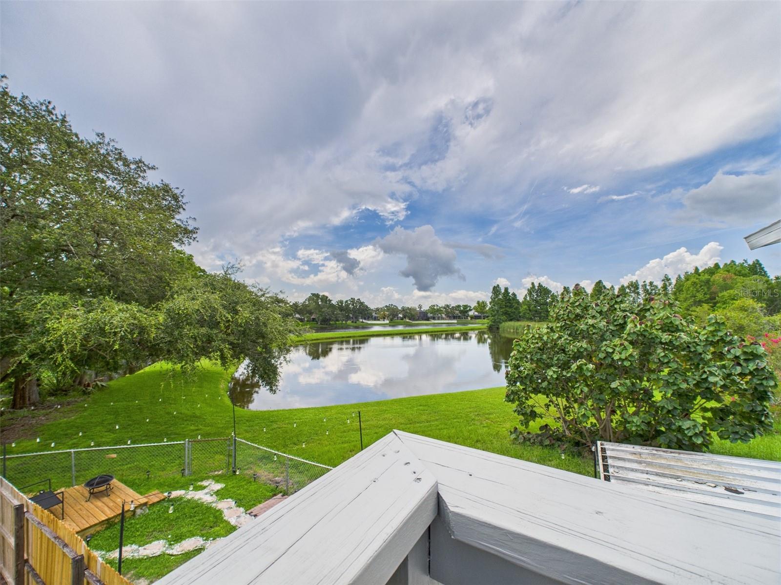 NO HOA! MARVELOUS WATER VIEW FROM YOUR BALCONY! Beautiful 2BR 2.5BA two-story townhouse in Oldsmar, FL. Master bedroom has French doors that open to a wonderful water view right in your backyard....enjoy the view of two lakes and a creek with stunning wildlife! Best of all, you get to rest assured that your property is high and dry, NO WATER INTRUSION! The property features an in-demand open concept floor plan layout & an L-shaped kitchen area with granite counter tops, under stair storage, kitchen pantry, newer bathroom vanities with tons of counter space and storage in the master bedroom. Upgrades galore including a new upgraded electrical panel, screened back and front porch with security camera and doorbell, new air conditioner with programmable thermostat, new hurricane sliders, new Energy Star stainless steel refrigerator/freezer, new disposal and new reverse osmosis water system. RENTED solar system proven to lower electric bills. Tile and laminate flooring throughout. The front and back porches are screened, and the backyard area is spacious and fenced...perfect for backyard parties and barbecues, pets, gardening, or any other activity you can imagine, thanks to no HOA and no CCD restrictions! The master bedroom features a spacious balcony with a charming view of the nearby lake and creek. Property is also equipped with an indoor laundry closet including Energy Star front loader washer and dishwasher. Just minutes away from Mobbly Bayou Beach Park, the local theatre, grocery store, hospital, and many other services. NEW ROOF 02/2023. NEW HVAC 2023. NEW WATER HEATER 2023. Seller financing and private financing available. DO NOT WAIT; it will not last long!