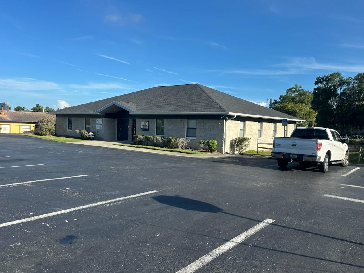 Exceptional Investment or Owner/User Opportunity! Properties like this are a rarity in this location - this well positioned office building in the heart of Downtown Ocala is a must see! This fully leased 3,444 SF property sits on a .29-acre parcel with highly flexible FBC Zoning, allowing for a wide range of uses. The building is divided into two units: Unit 1 features multiple individual office suites with established tenants under lease, while Unit 2 is currently occupied on a month-to-month basis — ideal for an owner needing immediate space or for securing a new long-term tenant. Positioned for maximum convenience, this property offers excellent access from both Pine Avenue and downtown streets, and is just minutes from Ocala’s premier amenities, including medical services, dining, shopping, and professional resources. A new roof installed in 2024 provides added peace of mind, and the building has been meticulously maintained. This is a prime opportunity for investors or owner-occupants looking to secure a premium downtown location with built-in income.