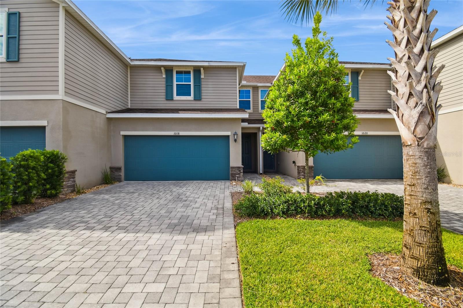 Welcome to this stunning townhome located in the maintenance free, gated community of Bearss Landing! Built in 2021, this 3-bedroom, 2.5-bathroom residence with 1,631 square feet and a 2-car garage combines modern design with everyday comfort. From the moment you enter, natural light fills the open floor plan, creating a warm and welcoming atmosphere. The great room and dining area are the perfect place to gather and entertain and a half bathroom completes the first floor. The kitchen is a chef’s dream and includes stainless steel appliances, beautiful cabinetry and a kitchen island with seating for four. The kitchen flows seamlessly into the dining and great room where oversized sliding doors open to a covered patio—an ideal spot for morning coffee or relaxing at the end of the day. Upstairs, the primary suite provides a private retreat with a spa-like bath and generous walk-in closet. Two additional bedrooms and a second-floor laundry room add convenience and flexibility. Nestled within a quiet, gated enclave, Bearss Landing offers low-maintenance living with unmatched convenience—just minutes from I-275, downtown Tampa, USF, and top shopping and dining destinations.