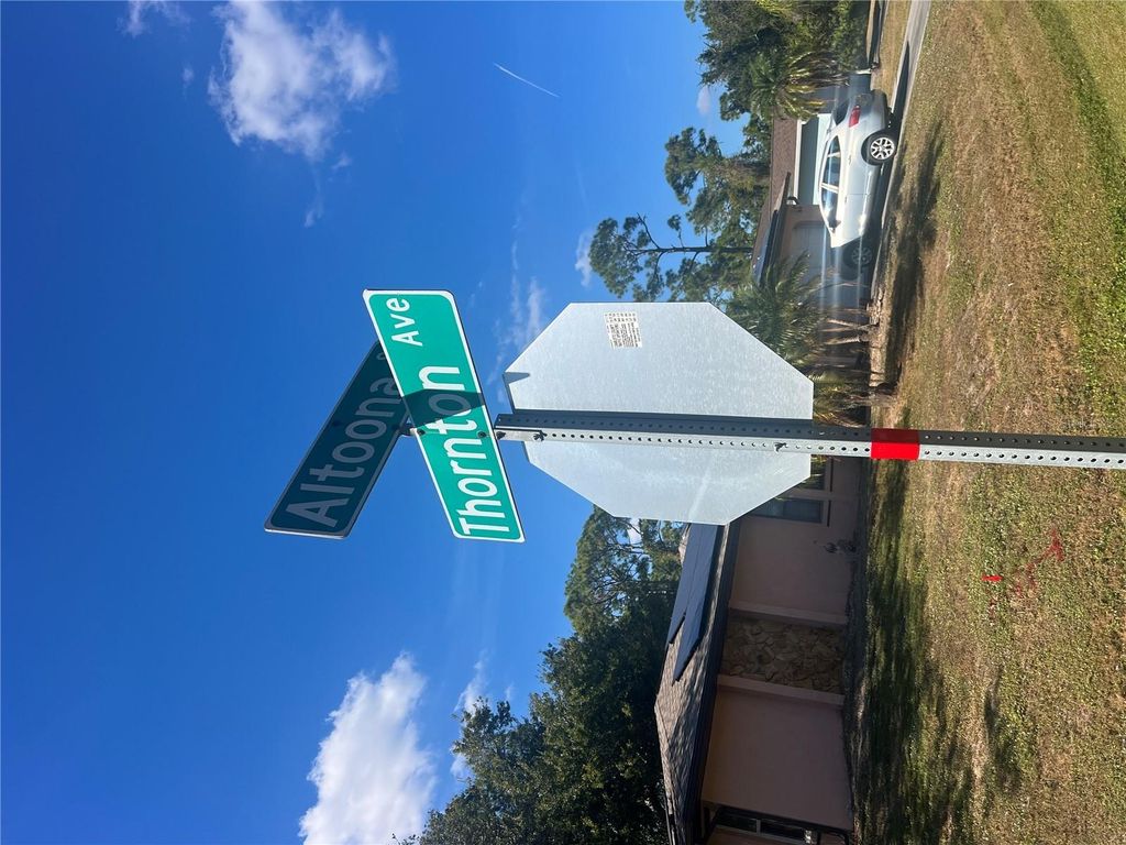 Photo of 831 Thornton Avenue NW, Port Charlotte, FL 33948 (MLS # TB8449513)