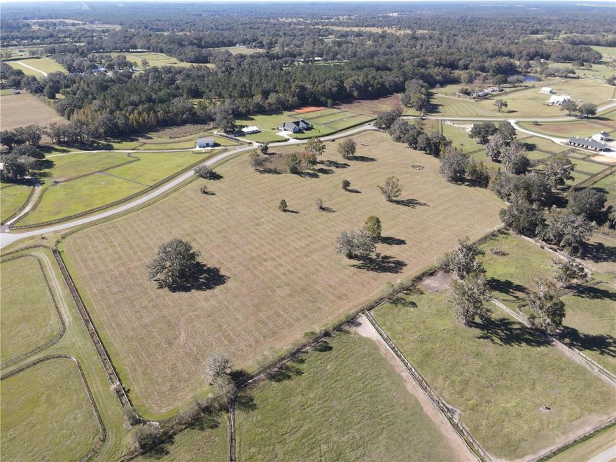Set within the gated equestrian community of Sand Hill Creek in NW Ocala, this 15.5 acre parcel offers abundant opportunity to create your farm from the ground up! Located just 10 minutes from HITS and 11 minutes from the World Equestrian Center, this property is the perfect option for equestrians looking to be near some of the area’s most exciting competition and show venues. This property is currently perimeter fenced with 4 board fencing and is a perfect blank canvas to create the farm of your dreams with many lovely homesites on the property to choose from. The land features a nice roll with no flood plain and mature trees scattered that add to the stunning landscape. Sand Hill Creek is a deed restricted community of 8 parcels, which features a common area, some bridle trails, a custom design key-pad controlled entry gate, and underground amenities to keep the natural beauty intact. With its prime location, picturesque setting, and customizable potential, this property is a rare opportunity to craft the equestrian lifestyle of your dreams in one of Ocala's growing communities!