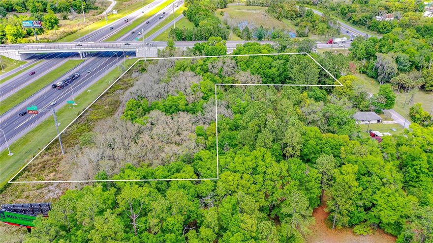 I-4 property adjacent to exit ramp in an area of central Florida experiencing growth. This 4.11 acres has approx. 620’ of I-4 frontage along with being a corner lot with approx. 405’ feet of Main Street frontage and approx. 245’ feet of Church St. providing an opportunity for creative and convenient design with ample access for your commercial project. This area of I-4 sandwiched between Orlando and Daytona and generates Average Daily Trips (AADT) of 94,500of I-4 traffic passing this property with direct interstate exposure. The property is also sandwiched between the City of DeLand and Lake Helen which are growing communities welcoming commercial projects. The property is zoned Gateway Commercial District allowing multitude of commercial opportunities and located at I-4 Exit 116 and just across the overpass from Victoria Park, which is a very large-planned unit community with golf course, medical center and village center with continuing growth in this area. Sale includes 4 parcels (713001780010, 713001780040, 713001780031 & 713001780030). An additional 0.843 acres (parcel 713001780023), immediately adject to this parcel, is also available increasing total acres almost 5 acres.