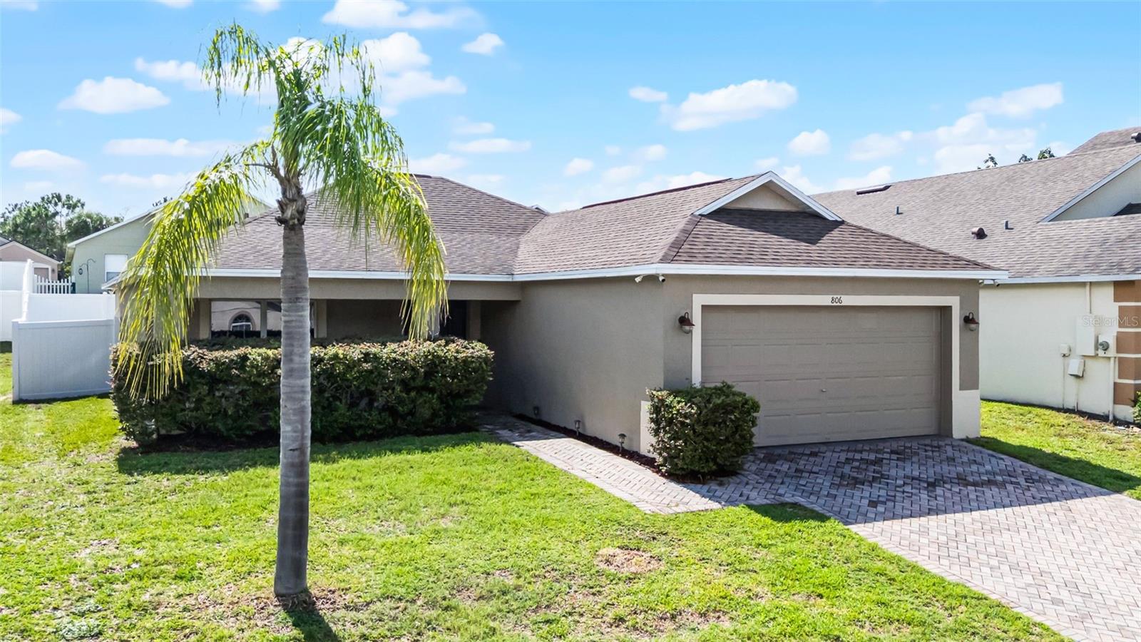 Welcome to your dream home in the desirable West Haven community of Davenport, Florida! This charming single-story residence features 3 bedrooms and 2 bathrooms across 1,320 square feet of thoughtfully designed living space. The modern, open-concept layout offers the perfect blend of comfort and functionality, with a bright and airy living and dining area that’s ideal for both everyday living and entertaining. The upgraded kitchen includes stylish finishes, ample cabinetry, and plenty of counter space to inspire your inner chef. Step outside to a private, fully fenced backyard with a custom paver patio and stylish shade sails, creating an inviting outdoor space you’ll enjoy year-round. The covered front porch enhances the home’s curb appeal, offering a warm welcome to guests. As part of a gated community, residents enjoy access to exclusive amenities like a community pool and tennis courts, all within a secure and well-maintained neighborhood.
Located in the heart of Central Florida, this home puts you just minutes from the magic of Walt Disney World, Universal Orlando, SeaWorld, and Posner Park Shopping Center, where dining, retail, and entertainment options abound. Outdoor enthusiasts will love exploring Northeast Regional Park and Lake Louisa State Park, while golf lovers can tee off at nearby Champions Gate and Highlands Reserve Golf Clubs. The area also benefits from a thriving local economy, supported by a variety of employment opportunities. Whether you’re looking for adventure, relaxation, or a bit of both, this home offers the perfect balance of style, comfort, and location. Schedule your private tour today—your ideal Florida lifestyle starts here!