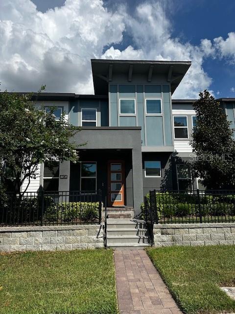 Location, location, charming energy efficient 4 bedroom,2 bathroom,town home with lots of smart home features in stunning Sand Lake Sound Sand Lake Sound is a lake front gated community with resort style swimming pool, splash pad, playground, dog park, community dock/kayak rack, the list goes on. Come enjoy this contemporary townhome with views of Orlando Eye and Sand Lake in the heart of Dr. Phillips area, just short walk to renowned restaurant row. International Drive, world class shopping, Universal Scheme Parks and SeaWorld are just minutes away. A rated school district of Dr. Phillips high school, Southwest Middle school, Dr. Phillips elementary. Hurry and schedule your showing, this one will not last.