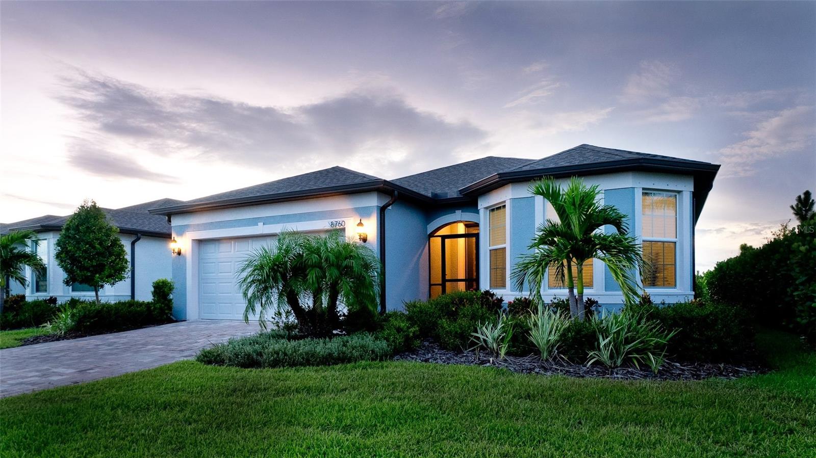 Discover this beautifully appointed 2-bedroom, 2-bathroom single-family residence located in the gated 55+ community of Del Webb. Perfectly positioned on a premium private corner lot, this home offers a serene retreat, with an abundance of privacy and all the benefits of a vibrant, active adult lifestyle.
Step inside this charming home featuring a versatile den, perfect for a home office, reading nook, hobby space, or guest area. The den adds flexible living space to suit your lifestyle, offering privacy and comfort while staying connected to the heart of the home. Continue inside to a bright and airy open-concept living space highlighted by a decorative hand-crafted stone fireplace—a stunning focal point that brings charm to the living room. The chef-inspired kitchen features gleaming granite countertops and custom backsplash. The kitchen island serves as the centerpiece, with ample countertop space for culinary creations and a casual spot for friends and family to gather. Adjacent to the kitchen is a cozy dining area with a window and sliding doors leading to the relaxing lanai.
Enjoy year-round comfort on the screened-in covered lanai, surrounded by lush landscaping that enhances the home’s secluded and peaceful setting. The spacious 2-car garage with an extended area provides extra storage or workspace, while built-in hurricane shutters can give you valuable peace of mind.
The luxurious primary suite includes a spa-like ensuite bath and a walk-in closet, while the guest bedroom and bath create a welcoming space for visitors. Resort-style community amenities include: an elegant clubhouse and on-site restaurant for social gatherings. A sparkling resort-sized swimming pool perfect for relaxing afternoons, state-of-the-art fitness center, tennis and pickleball courts, and a dog park for furry friends. Enjoy the perfect blend of comfort, community, and carefree living in this vibrant 55+ neighborhood. Conveniently located near shopping, dining, and entertainment, this home offers the perfect blend of comfort, elegance, and an active social lifestyle in one of the area’s most sought-after communities.
