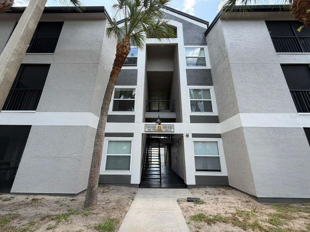 Photo of 7618 Pissarro Drive #15201, Orlando, FL 32819 (MLS # O6429468)
