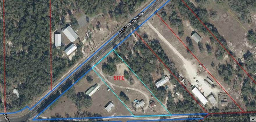 Commercial property located on a main State Road through Bronson Florida.  The property zoning will allow warehouses including offices and showrooms, retail spaces 15,000 square feet or less (Dollar General, Family Dollar, Dollar Tree), Self-Storage, Restaurants, Personal Services, and Adult and Child Care Facilities.   The property has a manufactured (mobile) home on the rear of the property allowing for a great live working environment.