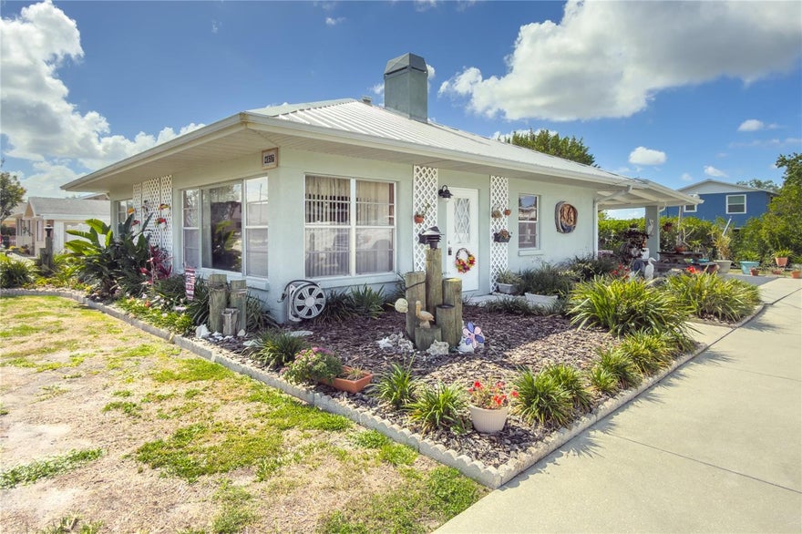 Enjoy the Florida waterfront lifestyle in this updated 2BR/2BA canal-front home with direct access to the Manatee River! Featuring 100 ft. of canal frontage on a quarter-acre +/- lot, this property is ideal for boating enthusiasts with a dock and 5,000 lb. davits. Updated kitchen and baths, ceramic tile flooring in wet areas, and new laminate flooring throughout living room and bedrooms installed in late 2024. The inviting living room showcases a beautiful stone fireplace (decorative/non-wood burning). Additional highlights include a 2020 metal roof, new refrigerator in 2025, detached shed with separate 60-amp electric panel, oversized concrete driveway with room for RV or boat parking, and a spacious covered patio perfect for year-round outdoor entertaining. Conveniently located near US Hwy 301, I-75, and Ellenton Prime Outlets. Seller is offering $10,000 credit to Buyer toward closing costs with a full price offer. Home being sold AS IS.