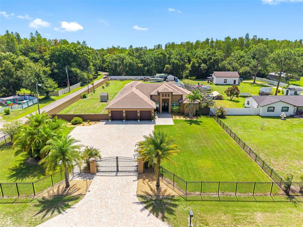 Photo of 17117 Lakeshore Road, Lutz, FL 33558 (MLS # TB8517828)