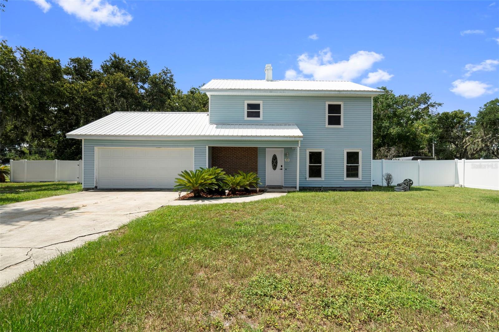 Discover this beautifully remodeled two-story home in the heart of Lakeland. Nestled on a spacious corner lot of nearly one acre (0.86 acres), this property offers ample outdoor space, perfect for those who appreciate tranquility and room to roam. Inside, you’ll find a stunning kitchen with wooden cabinetry and granite countertops, along with fully updated bathrooms and new flooring throughout. This home exudes a charming ranch-style vibe with all the modern conveniences. With its generous living spaces, including multiple living rooms, a formal dining area, and a double garage, this Lakeland gem is a must-see for anyone looking for a spacious and serene retreat.”