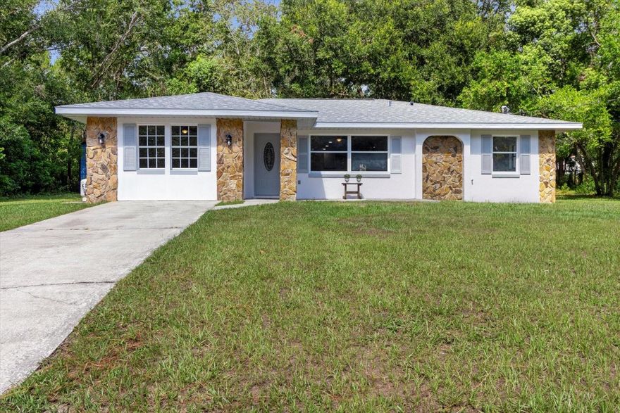 The Home You’ve Been Waiting For! Polished, pretty, and completely move-in ready, this charming 3-bedroom, 2-bath home with bonus room easily converts into a fourth bedroom. This beauty is nestled on a spacious half-acre homesite with room for all your toys and hobbies with an ample 2 car garage with extra tall roll up bay doors. With no deed restrictions, yet surrounded by a well-kept neighborhood, pride of ownership shines here. A brand-new roof in 2025 and easy-care luxury vinyl flooring throughout set the stage for stress-free living. The open floor plan offers comfort and flexibility. Great room layout affords a versatile living space. Additional Den makes a great home office space too! The sparkling kitchen with new stainless appliances will inspire your inner chef. Room for gathering or entertaining. The generous owner’s suite features a relaxing jetted tub, a separate enclosed shower, and plenty of space to unwind. Need more? The bonus room easily converts into a fourth bedroom, craft space, football den, or gamer’s retreat. Step outside to your shady, wooded backyard, a peaceful escape for morning coffee or evening gatherings. The detached two-car garage with extra-tall bays and a concrete floor provides ideal space for storage, projects, or a workshop. Homes like this don’t come along every day—schedule your showing before it’s gone!