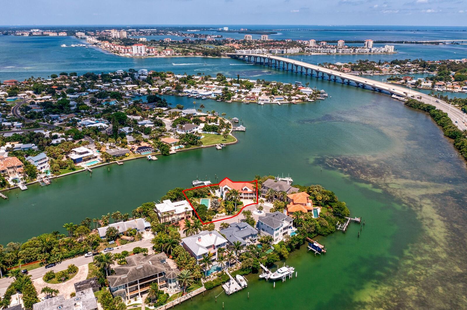 The perfect location for boaters and outdoor enthusiasts alike. At the end of a quiet cul-de-sac on Mangrove Point, this stately, private 3-story contemporary house offers deep water access to McPherson Bayou, a short boat ride away from the Gulf of Mexico. A beautiful, large pool area, covered cabana and oversized 16,000+ square foot lot create an ideal, comfortable space to grill, entertain, and take full advantage of the year-round Florida weather in “Sunshine City.” A seamless flow from the kitchen to the family room generates a peaceful layout with vaulted ceilings and an airy ambience. An elevator provides easy access to all floors. Catch amazing views of the Pinellas Bayway Bridge and Intracoastal Waterway from sprawling 2nd and 3rd floor decks and bright windows. Walkable to historic, iconic destinations like the Don CeSar Hotel and Pass-a-Grille Beach, the neighborhood offers the small-town feel of St. Pete, but a Rays game at Tropicana Field is less than 20 minutes away. With ample land, on the water, and St. Pete’s best restaurants and beaches a short stroll away, this gem of a home is not to be missed.