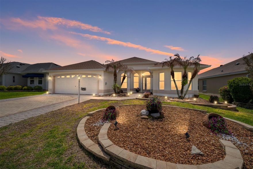 Welcome to this beautifully maintained Block and Stucco Magnolia Designer Home in The Villages, Florida, ideally positioned on a cul-de-sac in the Village of Piedmont, perfectly located between Nancy Lopez Country Club and Glenview Country Club - offering convenient access to championship golf, dining, recreation, and the unmatched Villages lifestyle.
This 3-bedroom, 2-bath home showcases a spacious, open-concept layout enhanced by vaulted ceilings, abundant natural light, and thoughtfully designed living spaces that feel both expansive and inviting. From the moment you enter, you’re welcomed by elegant finishes, clean lines, and a seamless flow ideal for both everyday living and entertaining.
The kitchen is the heart of the home, featuring granite countertops, newer stainless-steel appliances, ample cabinetry, and a functional breakfast bar that opens to the main living and dining areas, perfect for hosting or casual gatherings.
The primary suite offers a private retreat with generous space, two walk-in closets and a third is a cedar closet, and a beautifully updated en-suite bath featuring dual granite vanities and a luxury walk-in tiled shower. Guest accommodations are equally impressive, including a versatile front bedroom with a Murphy bed, ideal for guests or a flexible home office.
A standout feature of this home is the finished Florida room with French doors, creating an additional light-filled living space perfect for relaxing, entertaining, or enjoying indoor-outdoor living year-round.
Step outside to a spacious backyard featuring a concrete privacy wall, providing a rare sense of seclusion and tranquility. The home’s curb appeal is elevated with a paver driveway and walkway, mature landscaping, and a welcoming front entry.
Additional upgrades and features include: NEW ROOF (2021), solar tubes for enhanced natural light, electric screen garage door, and indoor laundry room with storage.
This home is the perfect combination of location, design, and lifestyle, making it an exceptional opportunity for those looking to buy in The Villages 55+ community.
Whether you’re searching for a full-time residence, seasonal retreat, or investment in The Villages, this Magnolia Model delivers space, style, and value in the north end of The Villages.