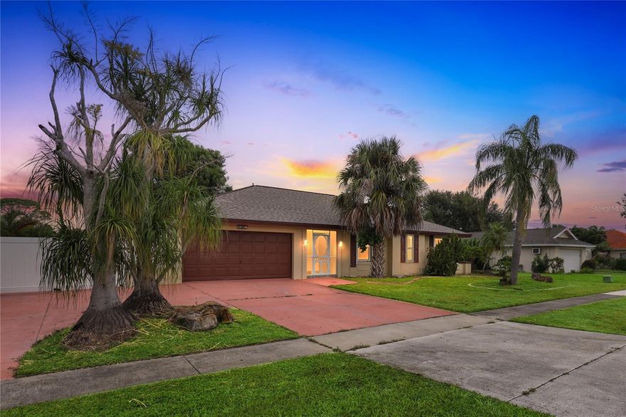 One or more photo(s) has been virtually staged. Tucked away in a tidy neighborhood you'll find the sanctuary you've been looking for. Enjoy the tranquility of canal living enhanced by abundant greenspace around your home and across the water. Imagine sitting outside and taking in all the different bird calls while you let the stresses of the day fall away. There is a spacious deck by the water, perfect for comfy outdoor furniture as well as ample patio space for grilling and entertaining. Head into the lanai for a more private getaway space, enjoy a cool evening breeze with a cup of tea and a good book. This leads you to the sun room with patio door access to the living room, dining room and owners suite. Inside the home you'll find a spectacular kitchen with cherry cabinets, stainless appliances and a granite countertop. With seating for 3 and loads of elbow room, the breakfast bar makes this the heart of the home! Homework area, prep space, buffet or work spot, it can be whatever works best for you. The sprawling living space is warm and welcoming with many options for your favorite pieces of furniture. There are 3 total bedrooms including a luxurious owner's suite with 2 closets, great counter space and full bath. An updated 3/4 bath, convenient laundry room and 2 stall garage complete this home tour.Once you're all settled, head just a few minutes south to the Paradise Marina for quick access to the Caloosahatchee River and some time on the water. Four Mile Cove Preserve and several parks makes this home an exceptional find.