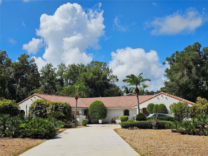 Welcome to your own slice of paradise on the private shores of Lake Lewis located in the highly sought-after gated community of Orchid Springs Estates! This stunning Mediterranean-style estate offers the perfect blend of luxury, comfort, and timeless elegance.  Boasting 4 spacious bedrooms and 4 full baths, this custom-designed home features a beautifully appointed kitchen ideal for entertaining, a dedicated pool bath for added convenience, and multiple living spaces filled with natural light. Step outside to your private screened-in pool oasis, where tranquil lake views and tropical landscaping create the ultimate Florida lifestyle experience.  Enjoy fishing, kayaking, or simply relaxing by the water in this serene, private lakefront setting. With premium finishes throughout and exceptional attention to detail, this home offers everything you need in one of the area's most distinguished neighborhoods.  Don’t miss this rare opportunity—schedule your private tour today!