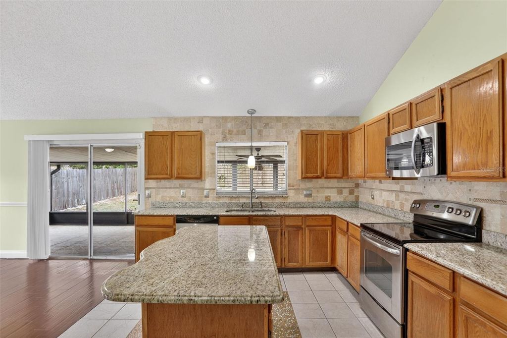 Photo of 7636 Dundas Drive, Orlando, FL 32818 (MLS # O6402117)