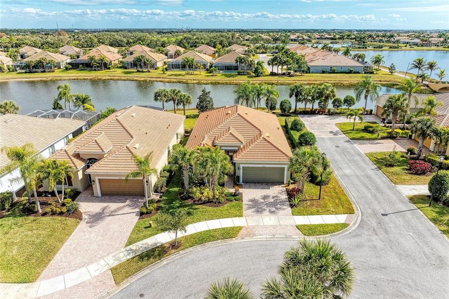 IslandWalk’s highly sought-after Vernon Hill model shines in this beautifully maintained lakefront home. Offering 3 bedrooms plus a dedicated office/den and 2 full bathrooms, the open-concept layout seamlessly connects the living room, dining area, breakfast nook, and kitchen—perfect for both everyday living and entertaining.

The desirable split-bedroom floor plan places the two guest bedrooms at the front of the home with a shared bath, providing privacy for family or visitors. A well-appointed laundry room features upper and lower cabinetry, a utility sink, and a folding station for added convenience.

The primary suite is a true retreat with tranquil lake views, a spacious walk-in closet, and a spa-like bath featuring dual vanities, a soaking tub, and a separate walk-in shower. The home features tile flooring throughout, laid on the diagonal, enhanced by crown molding and additional recessed can lighting. The tile has been professionally steamed and sealed—no carpet anywhere.

Enjoy peace of mind with IMPACT GLASS throughout and STORM SMART shutters on the lanai. The bright kitchen features quartz countertops, light cabinetry, upgraded stainless steel appliances, and a large pantry. Both the formal dining area and breakfast nook offer beautiful lake views.

Outdoor living is effortless on the covered lanai, where lanai furniture conveys, creating a move-in-ready space for relaxing or entertaining. This home is spotless, thoughtfully upgraded, and meticulously cared for—ready to enjoy the IslandWalk lifestyle.IslandWalk is one of VENICE'S most social communities with a FULL TIME ACTIVITIES DIRECTOR, countless events and clubs and activities, TWO community clubhouses, an EVENT center, TWO resort style pools, a LAP pool, 12 PICKLE BALL Courts, 8 Har Tru Tennis Courts, DOG PARK, Playground, Basketball Court, Community Garden- the list goes on! The entire community is surrounded by miles and miles of golf cart trails, walking and biking trails, VENETIAN bridges and water! The Atlanta Braves Stadium is a short bike ride away- enjoy year- round events and activities. The new marketplace features PUBLIX, restaurants, shopping, gas station, etc! Downtown Wellen Park features an 80-acre lake, retail shops, restaurant waterfront dining and rooftop decks, pedestrian-friendly streets, a splash pad, a playground and a public town hall gathering place that hosts live theater and music events. Coming soon to downtown Wellen Park- a hammock grove and a permanent food truck area. IslandWalk HOA includes grounds maintenance, CABLE, WIFI, amenities, and 24-hour guard.